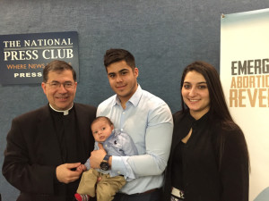 Father Pavone poses with young family following news conference in Washington on RU-486 reversal protocol